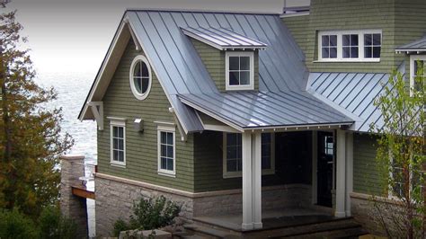 metal roof on green sided craftsman house|dark green metal roof.